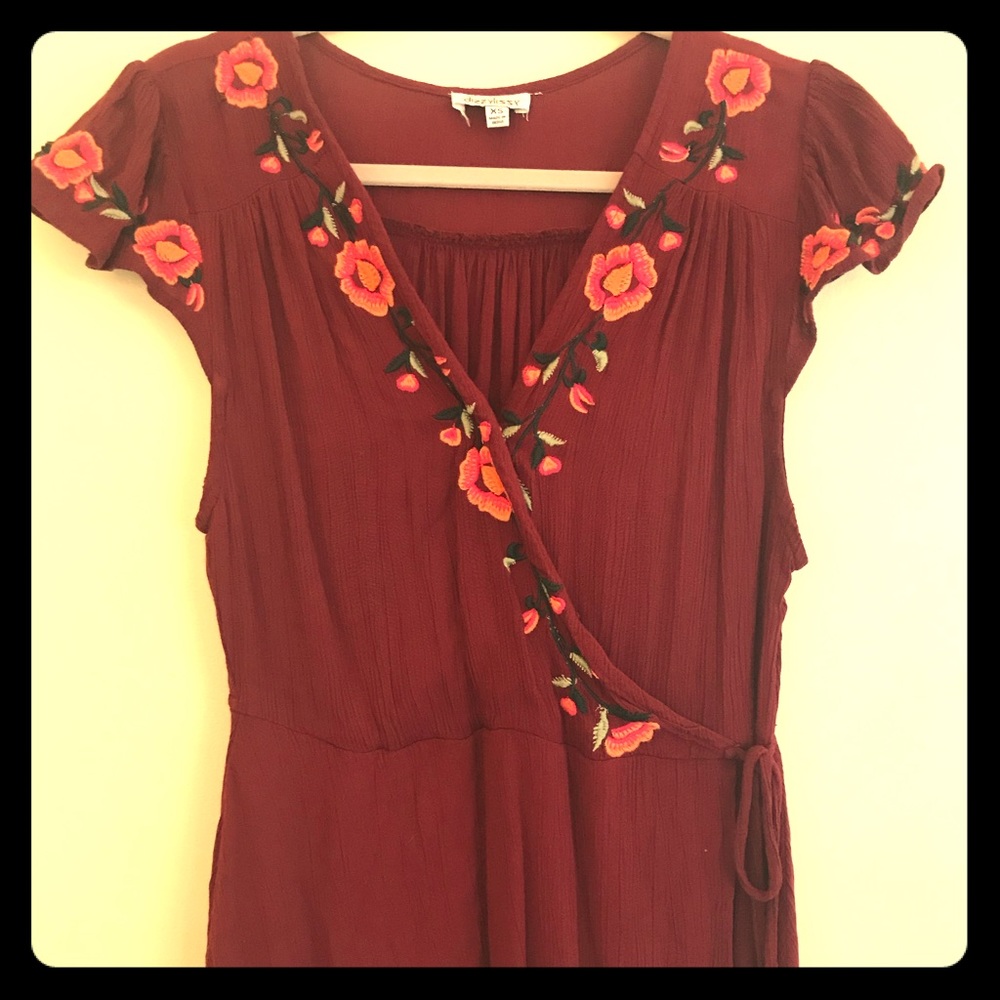 Merlot colored blouse with floral neckline